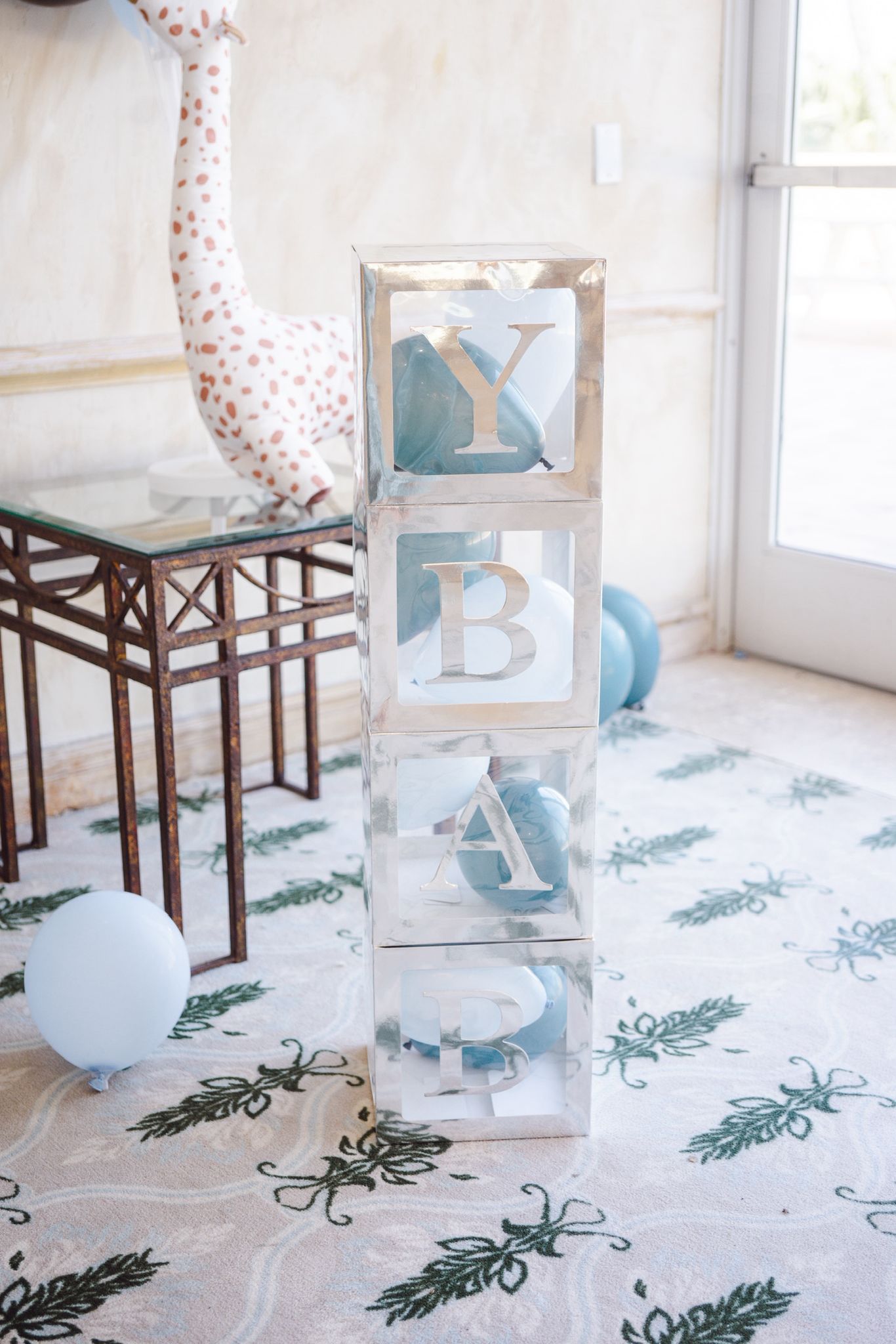 Luxury baby shower decor with BABY letter boxes and soft blue balloons